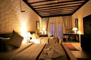 Voodi või voodid majutusasutuse Atana Musandam Resort toas