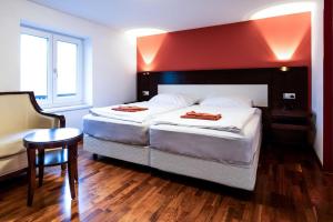 Postel nebo postele na pokoji v ubytování Hotel Linde-Sinohaus