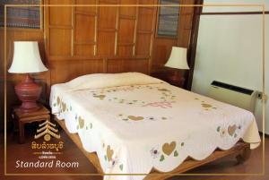 Postel nebo postele na pokoji v ubytování Hotel Siblanburi Resort