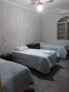 Cama o camas de una habitación en Araca Hotel