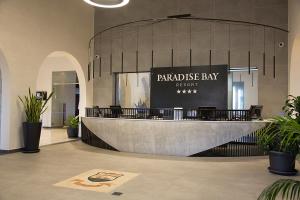 a restaurant with a table and chairs in a building at Paradise Bay Resort in Mellieħa