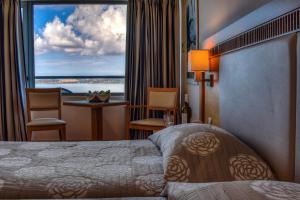 Een bed of bedden in een kamer bij Mediterranee