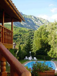 
a view from a balcony of a house overlooking a river at Hotel Picos de Europa in Arenas de Cabrales
