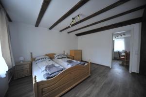 a bedroom with a large bed in a room at Old town center apartments on the Romantic Road in Harburg