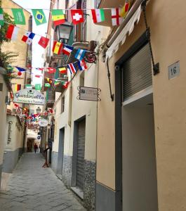 a street with flags and flags hanging from buildings at Sorrento Flats in Sorrento