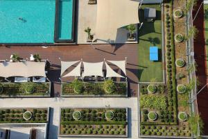 an overhead view of a building with a swimming pool at Olympic Residence Deluxe Apartments in Limassol