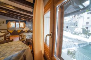 A bed or beds in a room at Hotel Appennino