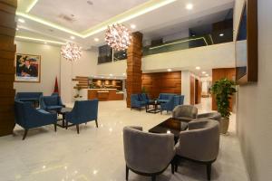 a waiting area in a hospital with chairs and a table at Golden Star Casablanca in Casablanca