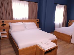 Postel nebo postele na pokoji v ubytování Oda Hotel Tirana