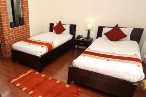 Letto o letti in una camera di Thamel Eco Resort