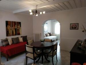 a living room with a table and a couch at Apartment Gio III in Zakynthos Town