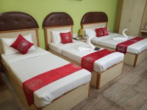 Ένα ή περισσότερα κρεβάτια σε δωμάτιο στο Kingston Palace