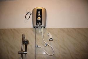 a shower in a bathroom with a shower at Miheen Hotel & Resort - Anuradhapura in Mihintale