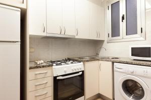 Kuchyň nebo kuchyňský kout v ubytování Barnapartments Monumental