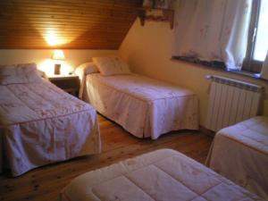 מיטה או מיטות בחדר ב-Casa Aranesa