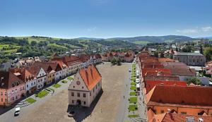 an aerial view of a town with buildings at Penzión Čergov in Hervartov