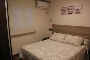 Postel nebo postele na pokoji v ubytování Hostal Extremeño