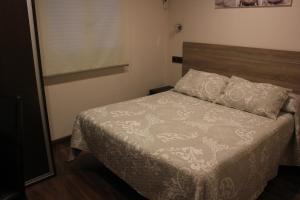 Postel nebo postele na pokoji v ubytování Hostal Extremeño