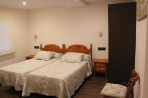 Postel nebo postele na pokoji v ubytování Hostal Extremeño