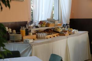 a table with a buffet of food on it at Albergo Nardini in Lentate sul Seveso