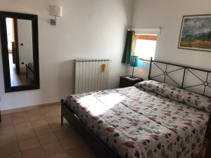 Tempat tidur dalam kamar di Residence Orto di Venanzio