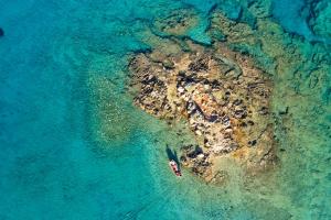 an aerial view of a small island in the water at Parian Boutique Hotel in Naousa