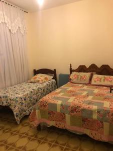 Posteľ alebo postele v izbe v ubytovaní casa em Martins de Sá