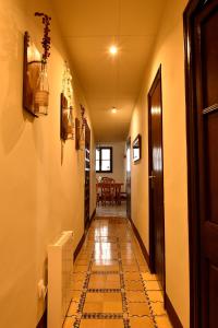 a hallway with a tiled floor and a door at EVA & TRAVEL - El Cor del Montsant in Ulldemolins