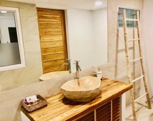 a bathroom with a sink and a large mirror at So KohKoon Beach Resort in Bang Rak Beach