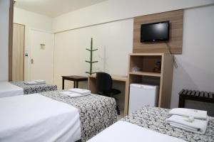 Postel nebo postele na pokoji v ubytování Royal Plaza Hotel