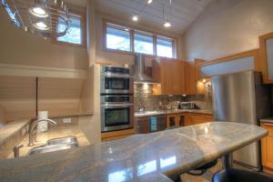 a kitchen with a large granite counter top at 127 Ridgepoint Townhouse in Beaver Creek