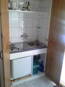 a small kitchen with a sink and a counter at Villa Delfin in Sutivan