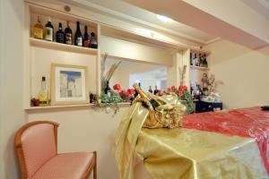 a room with a table with a mirror and some bottles at Villa Ianthia in Galaxidi