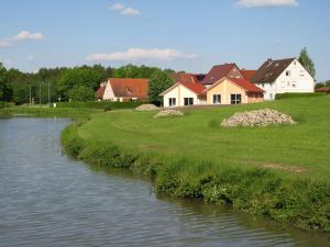 a house next to a river with houses at Karpfenhaus Feuchtwangen in Feuchtwangen