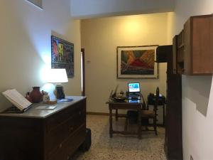 a room with a desk with a computer on it at B&B Sansevero Naples in Naples