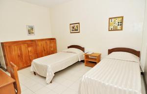 Postel nebo postele na pokoji v ubytování El Haciendero Private Hotel + 23 fotografií