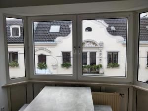 a window with views of a building at XXL Superior Old Town Apartment in Düsseldorf