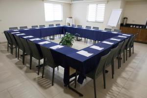 a long blue table and chairs in a room at innova8ion in Bethlehem