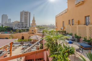 a view from the rooftop of a building with a clock tower at Hotel Santa Catalina By OxoHotel in Cartagena de Indias