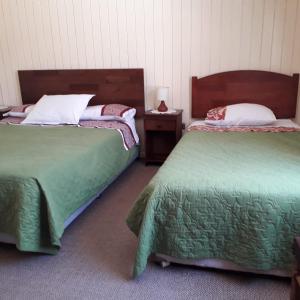 Postel nebo postele na pokoji v ubytování Hostal El mirador 2