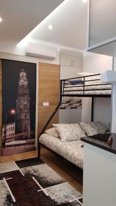 a bedroom with bunk beds with a picture of a building at Ninho 0.1 in Vila Nova de Gaia