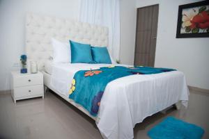 Ein Bett oder Betten in einem Zimmer der Unterkunft Hotel Platinum Barranquilla