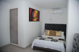 Ein Bett oder Betten in einem Zimmer der Unterkunft Hotel Platinum Barranquilla