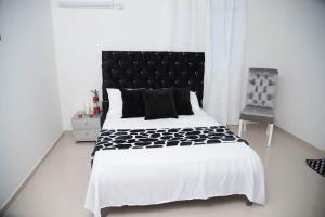 Ein Bett oder Betten in einem Zimmer der Unterkunft Hotel Platinum Barranquilla