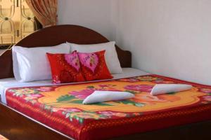Ένα ή περισσότερα κρεβάτια σε δωμάτιο στο Angkor Ruby Guesthouse