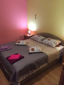 Ένα ή περισσότερα κρεβάτια σε δωμάτιο στο Гостевой Дом «ANIKA»