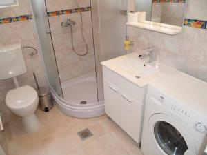 a bathroom with a washing machine and a sink at Villa Majer in Preko +55 photos