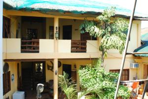 a view of a house with a balcony at Casa Aviara Resort & Hotel in Puerto Galera