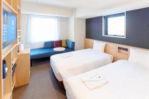 Postel nebo postele na pokoji v ubytování hotel MONday Tokyo Nishikasai