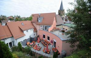 an aerial view of a building with tables and chairs at Landhotel Gasthof Krone in Kupferzell